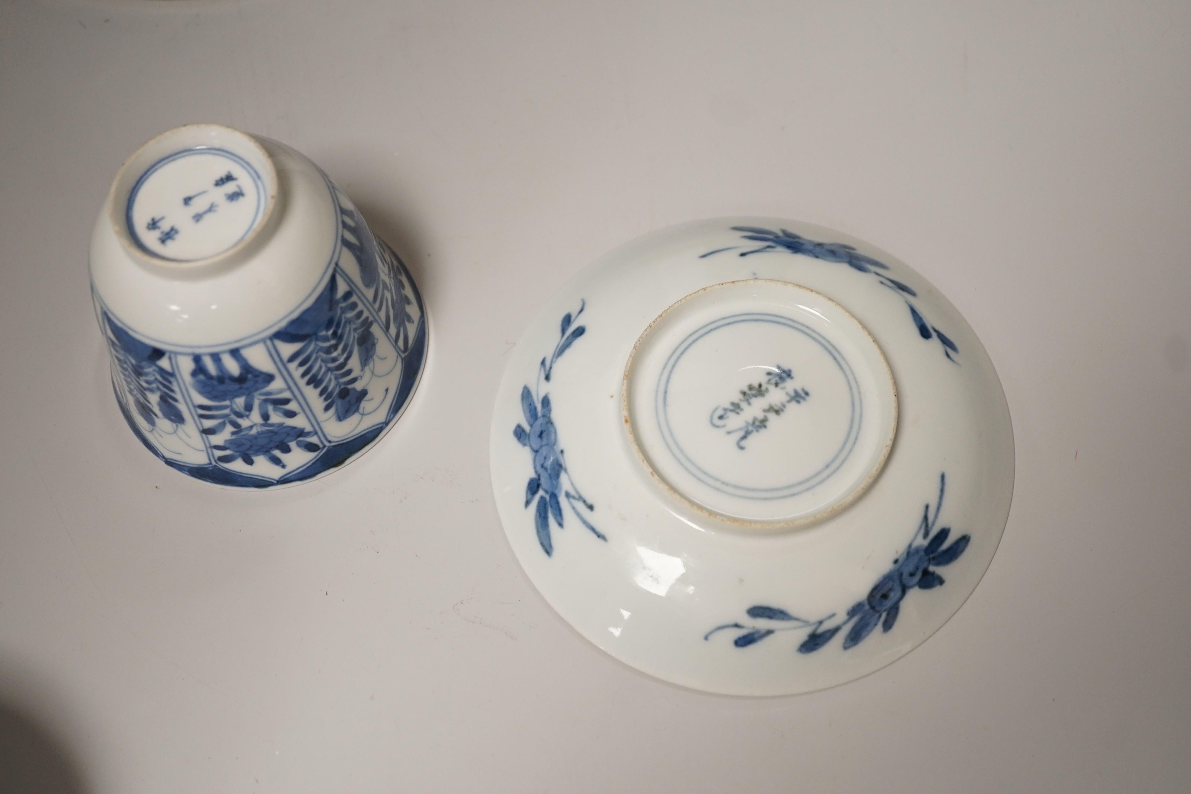 A Chinese blue and white brushpot, enamelled jar, brush pot, famille verte jar cover and a Japanese blue and white tea bowl and cover. Tallest 18cm